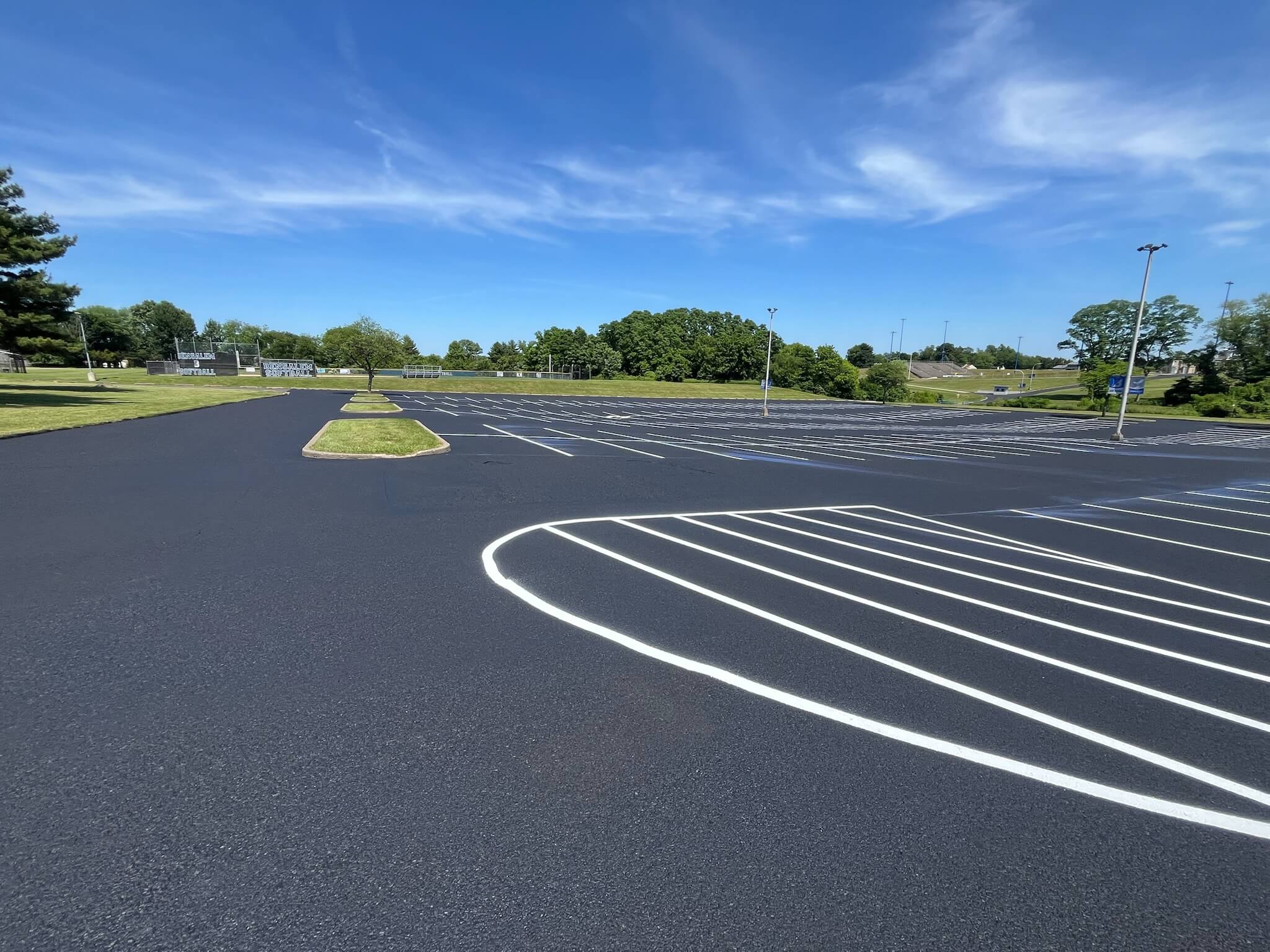 Freshly sealcoated parking lot at Bensalem High School in Bensalem, PA