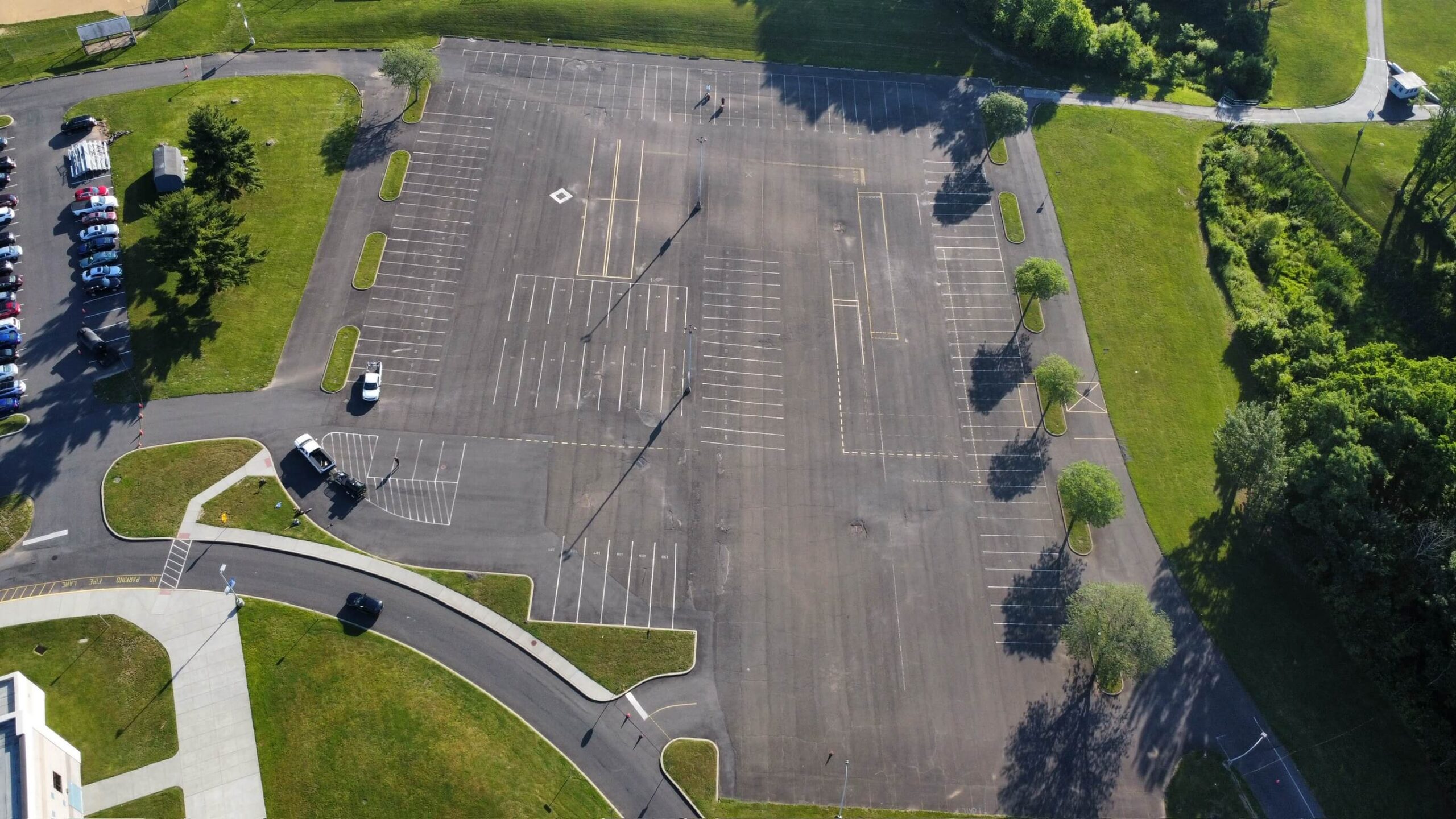 Wide view of 410,000 square foot Bensalem High School parking lot after sealcoating